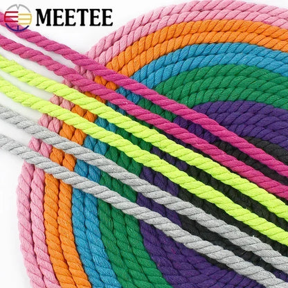 A close-up of multicolored twisted rope cords arranged in overlapping diagonal bands.