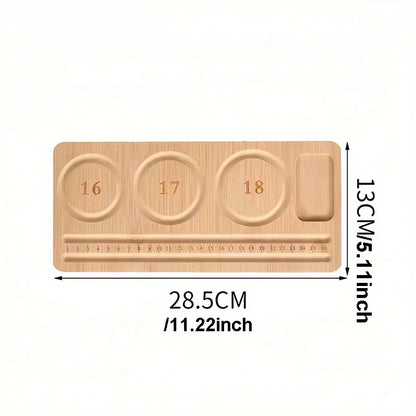 A light wood bead board tray with three circular pegs labeled 16, 17, and 18, a ruler slot, and a vertical rod, shown with dimension markings of 28.5CM (11.