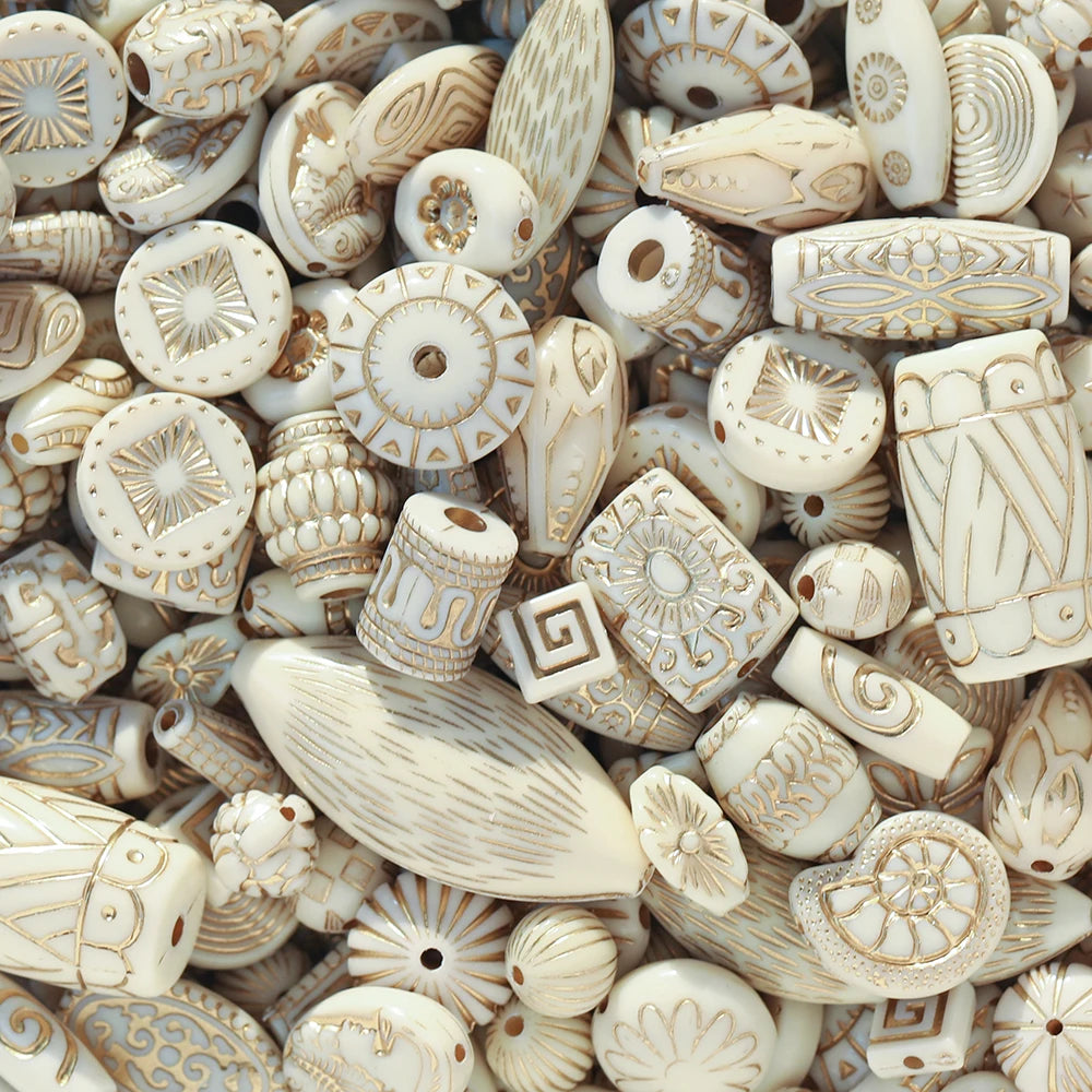 Collection of decorative bone beads with intricate patterns