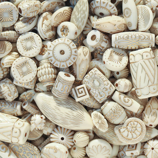 Collection of decorative bone beads with intricate patterns