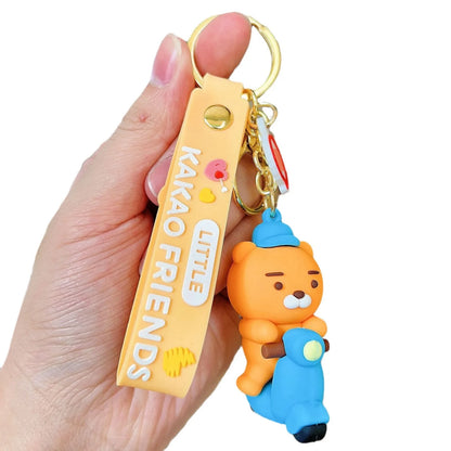 Keychain with a character from Kakao Friends held by a hand on a white background