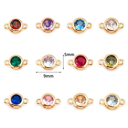 Twelve gold-tone round bezel settings with loop backs, each holding a different colored stone, arranged in a grid on a white background. Two center stones show dimension markings of 5mm and 9mm.