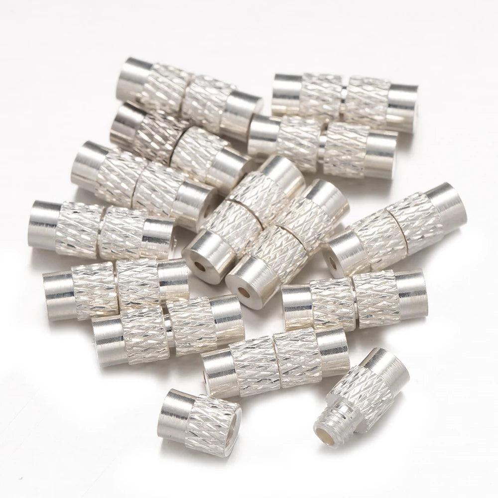 Silver metallic connectors on a white background