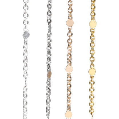Three gold necklaces for jewelry making of different designs on a white background