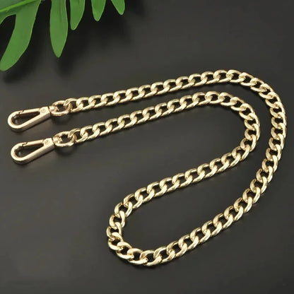 Gold chain with clasp on a dark background