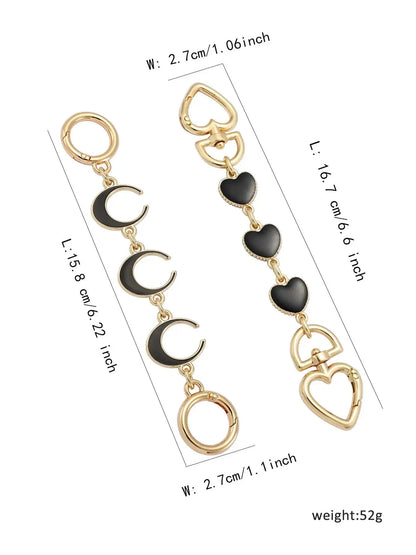 Gold and black heart, moon, and circle bag chain with measurements on a white background