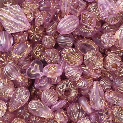 Assorted purple and gold beads with decorative patterns