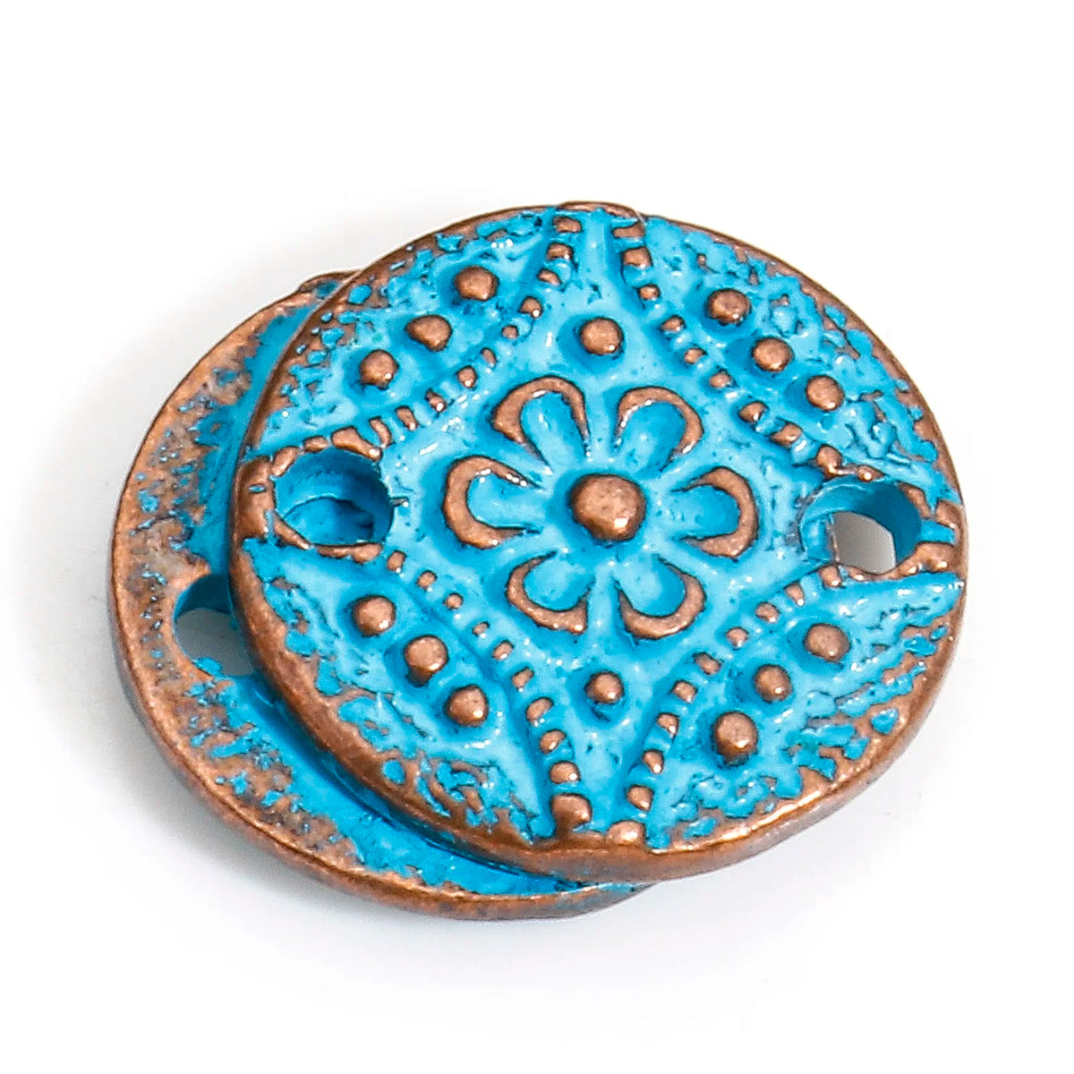 A pair of round turquoise and bronze decorative beads with a raised floral pattern and cutout holes, shown on a white background.