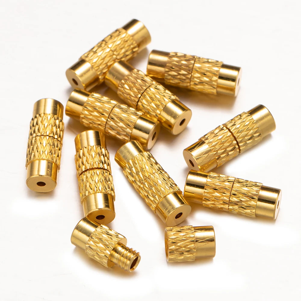 Gold metal connectors on a white background