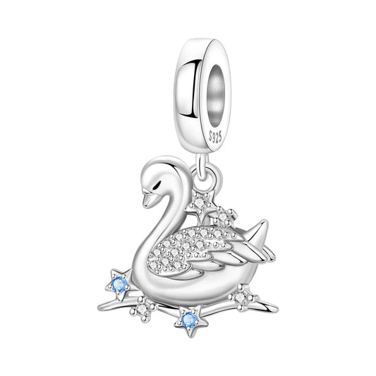 Silver swan charm with gemstones on a white background