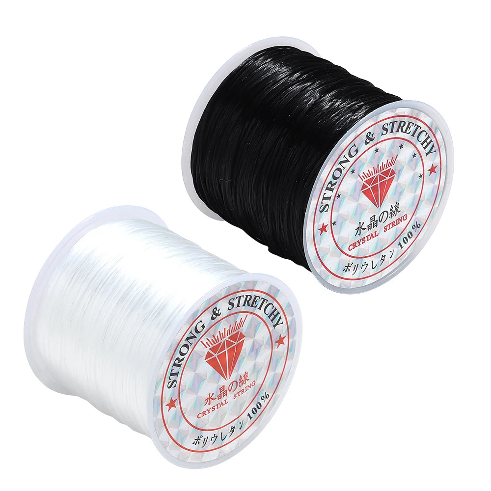 Two spools of strong stretch cord on a white background, one black and one clear/translucent, both with round white labels reading 'STRONG & STRETCH' and 'CRYSTAL STRONG'.