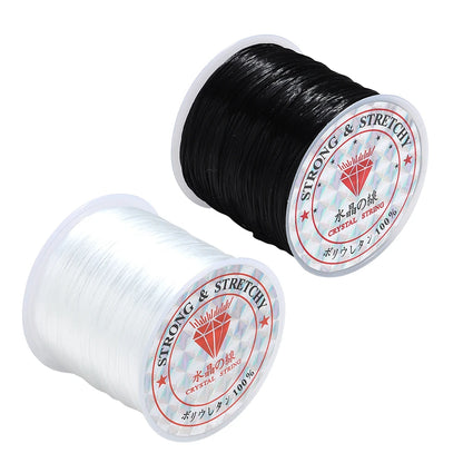 Two spools of strong stretch cord on a white background, one black and one clear/translucent, both with round white labels reading 'STRONG & STRETCH' and 'CRYSTAL STRONG'.