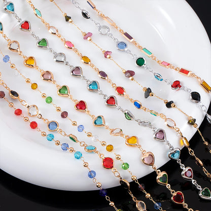 Colorful beaded necklaces on a white plate