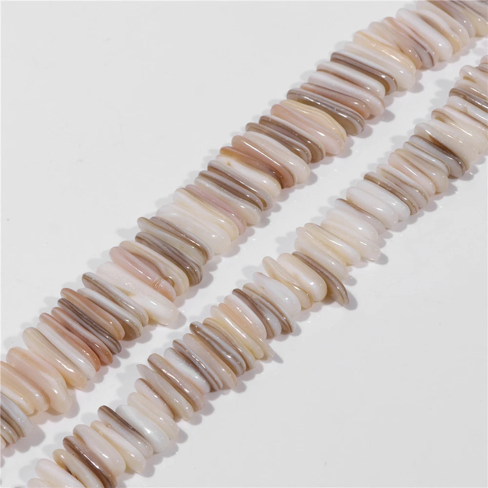 Necklace made of mother of pearl shell beads on a white background