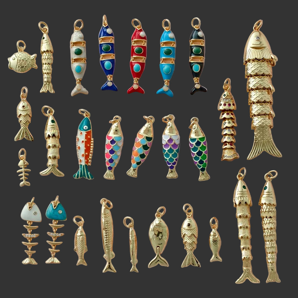 Collection of various fish-shaped pendants on a light pink background