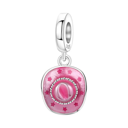 Silver charm with pink enamel and star details on a white background