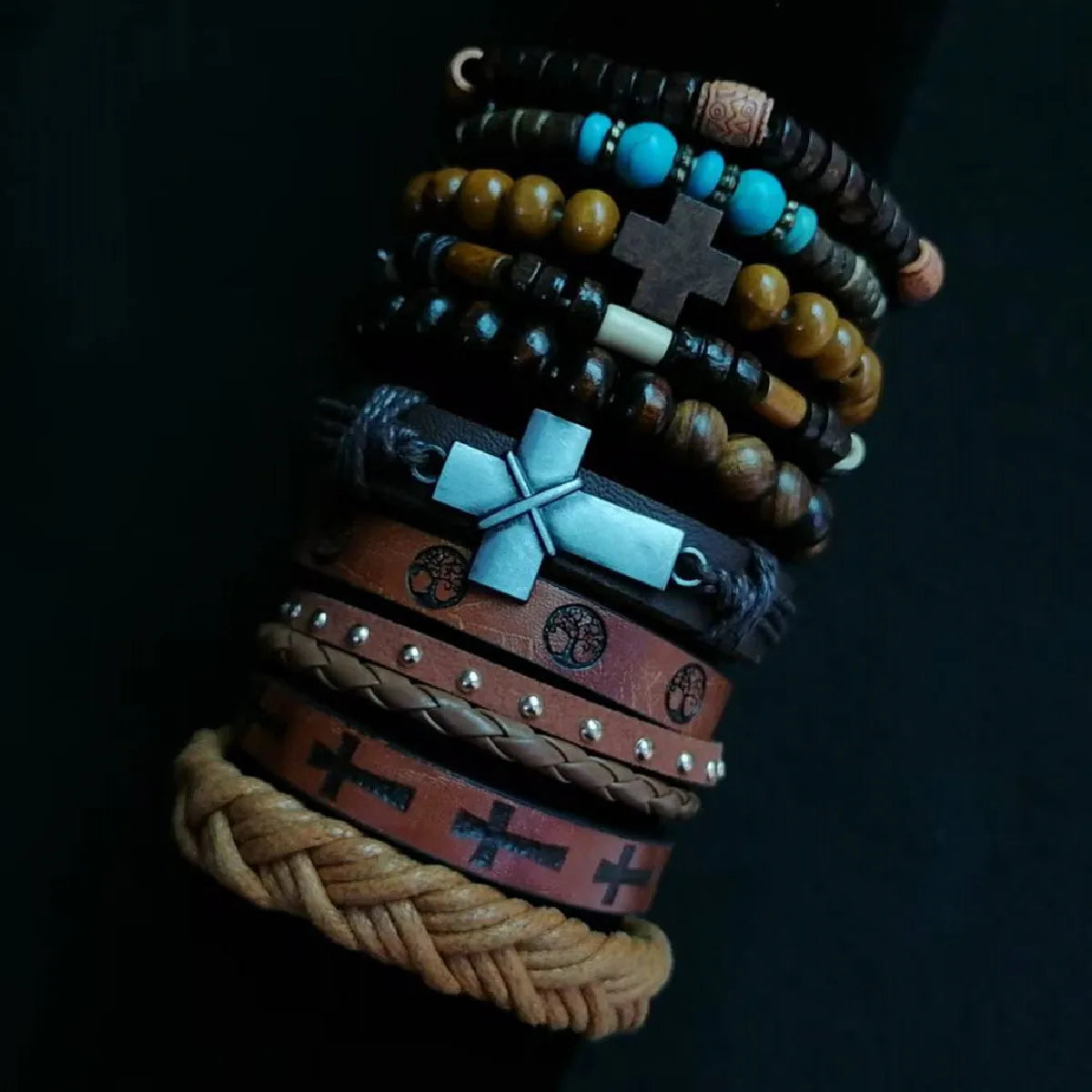 Collection of bracelets with various designs on a dark background