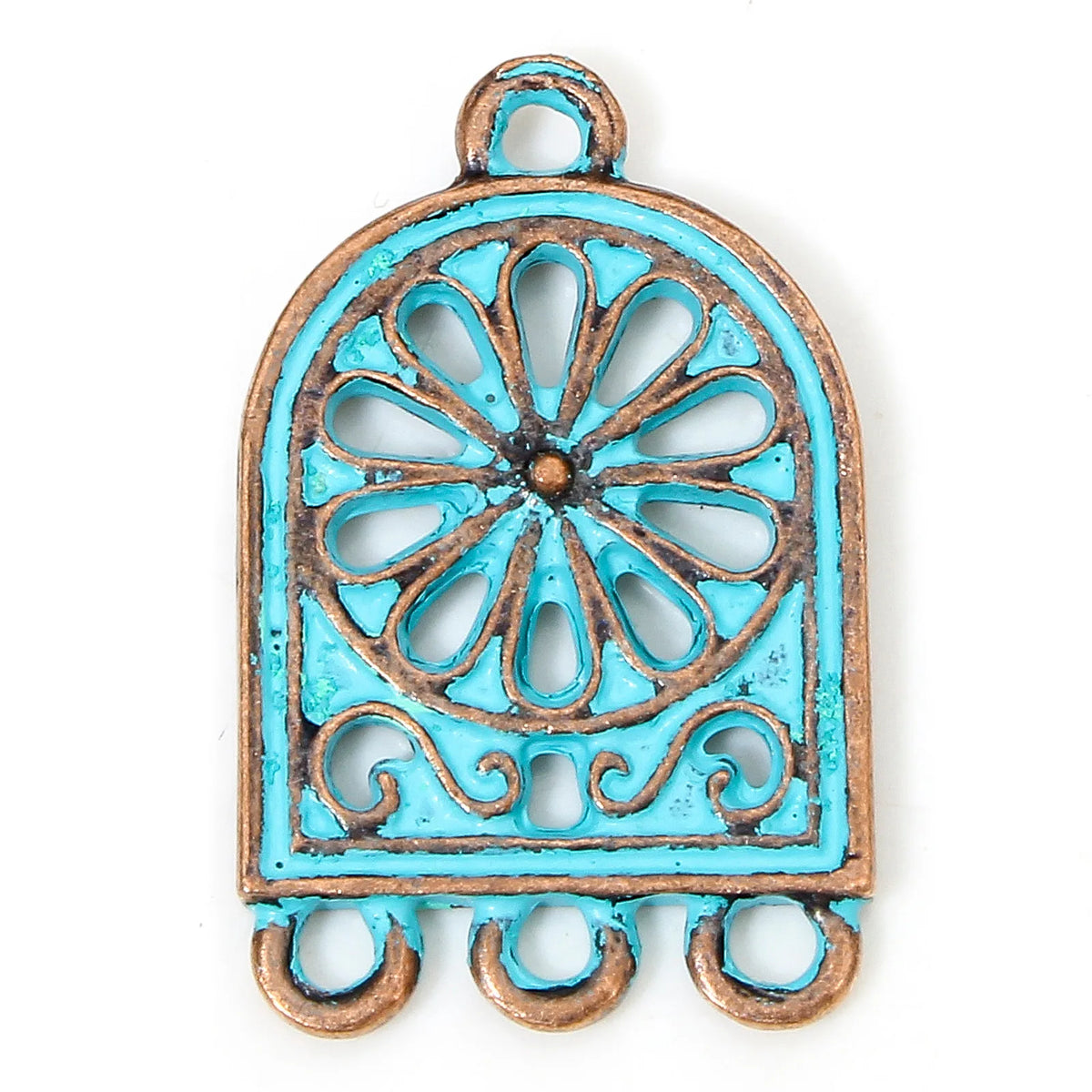A turquoise and bronze metal jewelry charm with a distressed finish, featuring a central floral wheel design and three hanging loops at the bottom, shown on a plain white background.