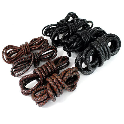 Four coiled braided rope cords in two brown shades and two black shades, arranged on a plain white background.
