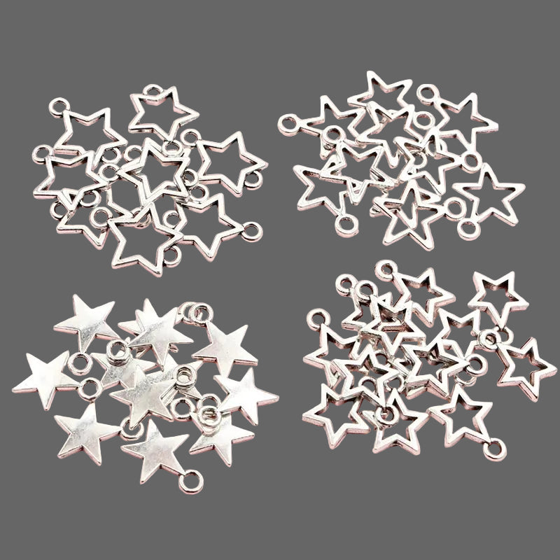 Silver star-shaped charms on a pink background