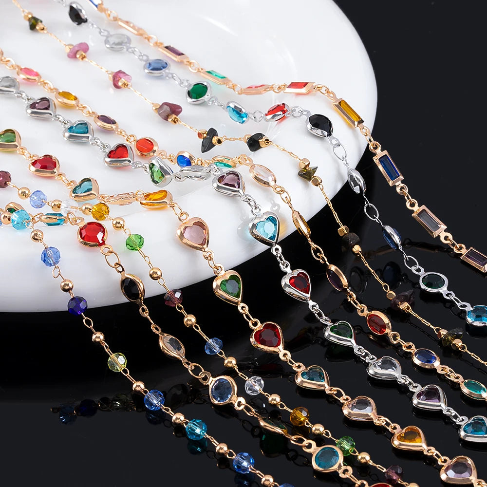 Colorful beaded necklaces on a white dish with a black background