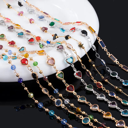 Colorful beaded necklaces on a white dish with a black background
