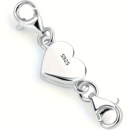Silver heart-shaped charm with lobster clasp on a white background