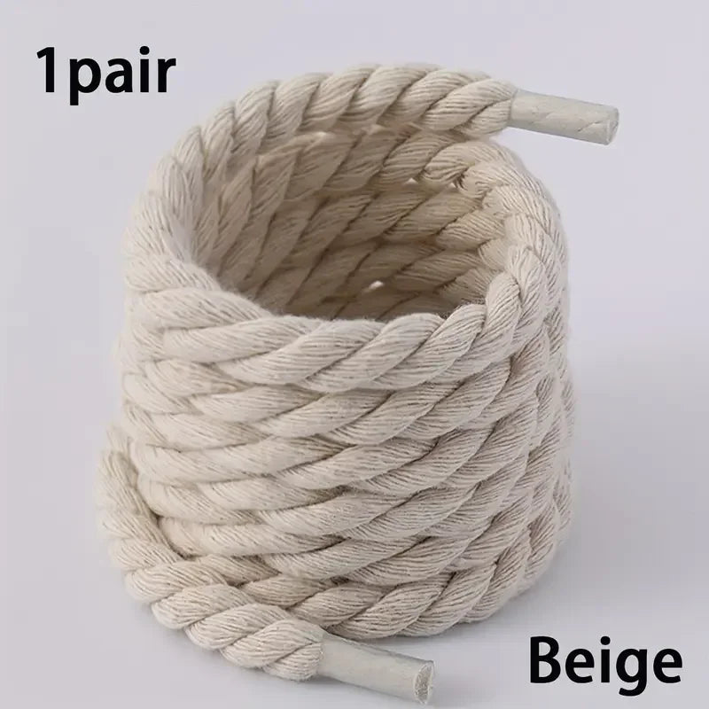 Beige rope with two ends on a light gray background