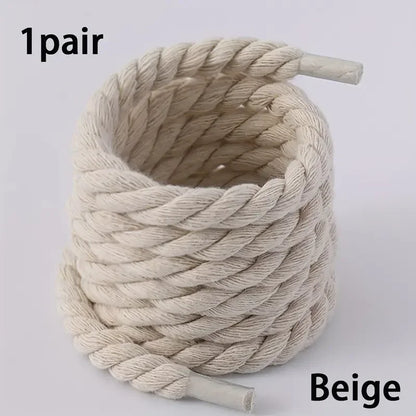 Beige rope with two ends on a light gray background