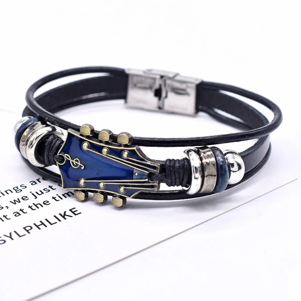 Multistrand leather bracelet with guitar-shaped clasp on a white background