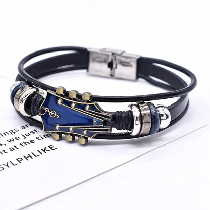 Multistrand leather bracelet with guitar-shaped clasp on a white background