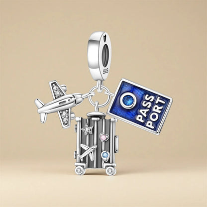 Charm with airplane, suitcase, and passport design on a beige background