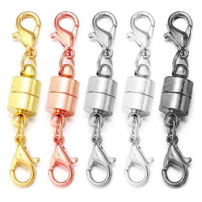 Set of five metal clasp connectors in gold, rose gold, silver, and two other metallic colors on a white background.