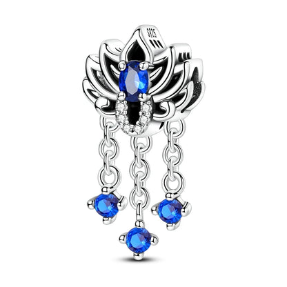 Silver pendant with blue gemstones on a white background