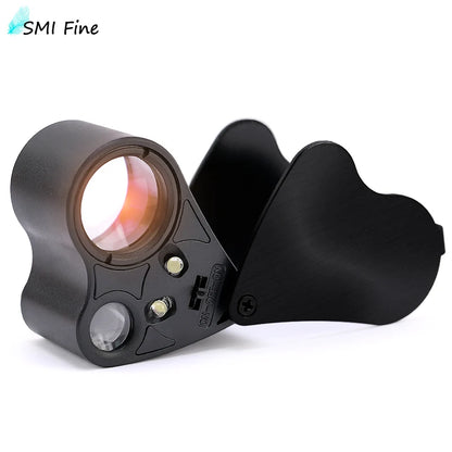 Black magnifier lens on a white background, featuring SMI Fine branding.