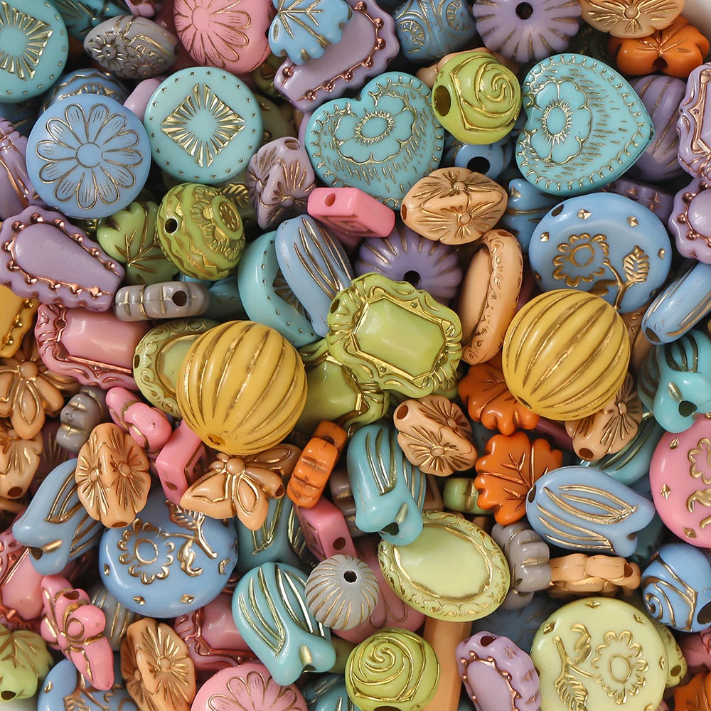 Assorted colorful decorative beads with intricate designs.