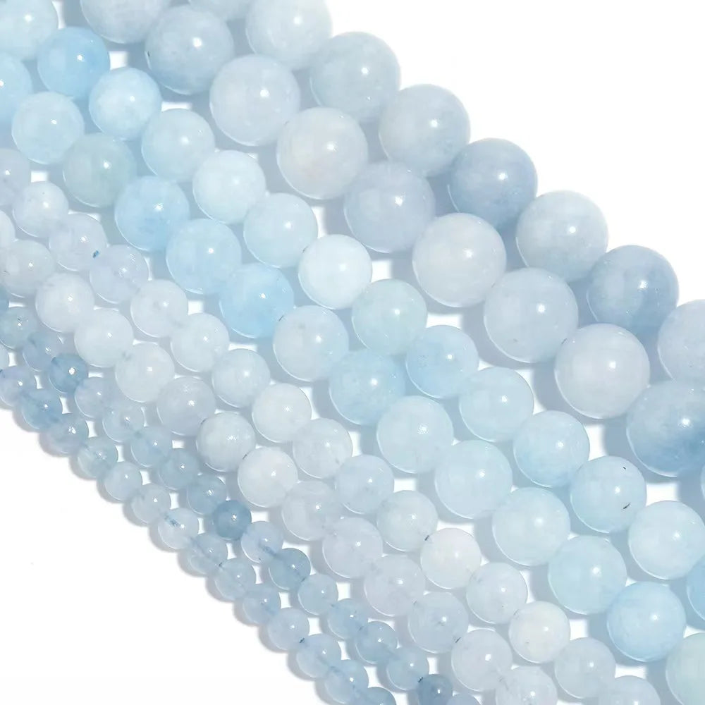 String of light blue beads on a white background