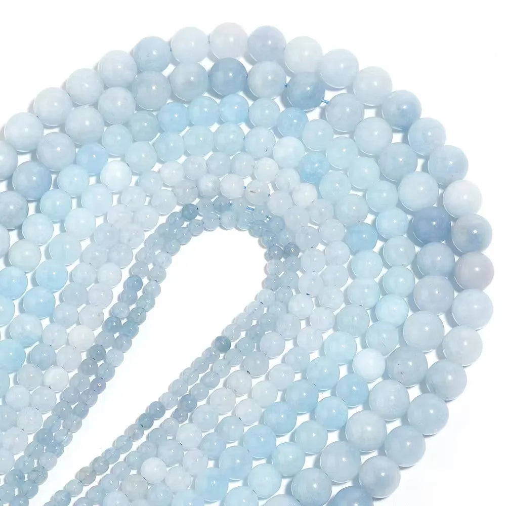 String of light blue beads on a white background