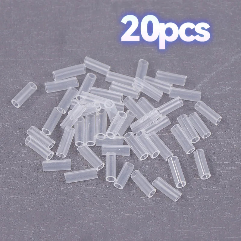 A pile of 20 small clear plastic tube sleeves on a dark gray textured background, with '20pcs' text overlay at the top.