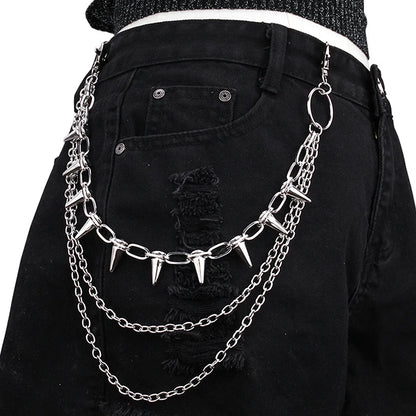 Black pants with a silver chain belt featuring spikes worn by a person.