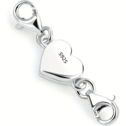 Silver heart-shaped charm with lobster clasp on a white background
