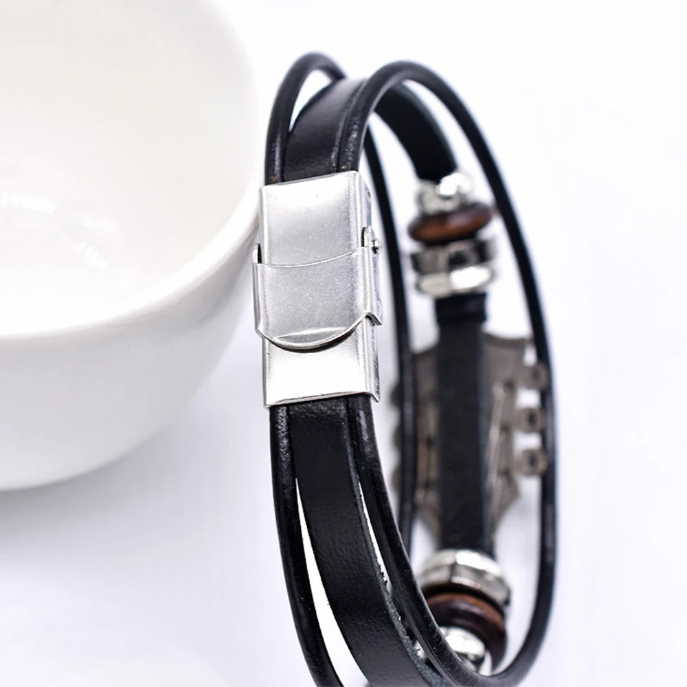 Black leather bracelet with silver clasp on a white background
