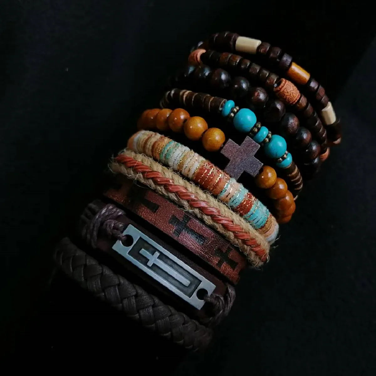 Stack of various beaded bracelets on a dark background