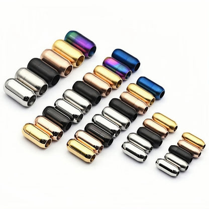 Colorful cylindrical metal clasps on a white background