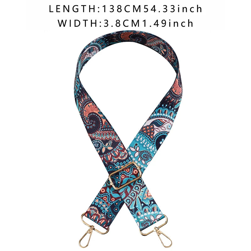 Patterned strap with gold hardware on a white background