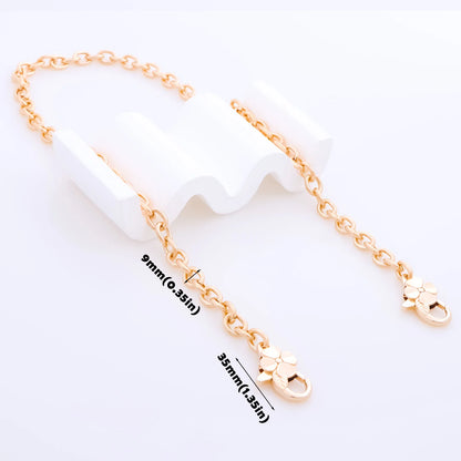 A gold-tone chain extender strap with a lobster clasp and flower charm, displayed on a white background with dimension labels showing 9mm and 35mm.