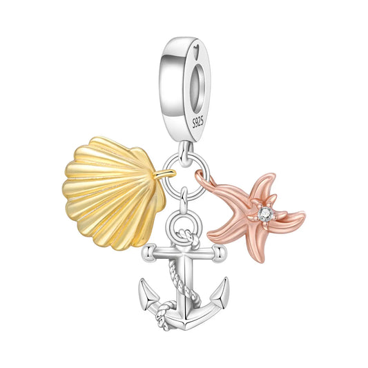 Jewelry charm with shell, anchor, and starfish on a white background