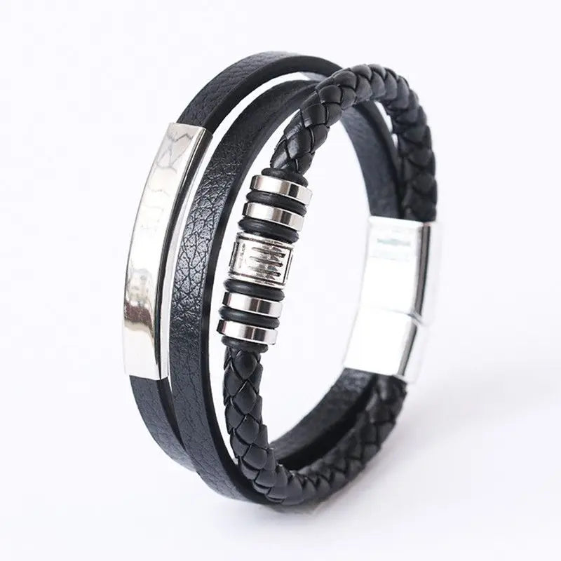 Black braided leather bracelet with silver metal accents on a white background