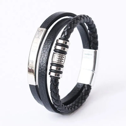 Black braided leather bracelet with silver metal accents on a white background