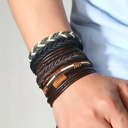 Close-up of a wrist wearing multiple braided leather bracelets with metal accents.